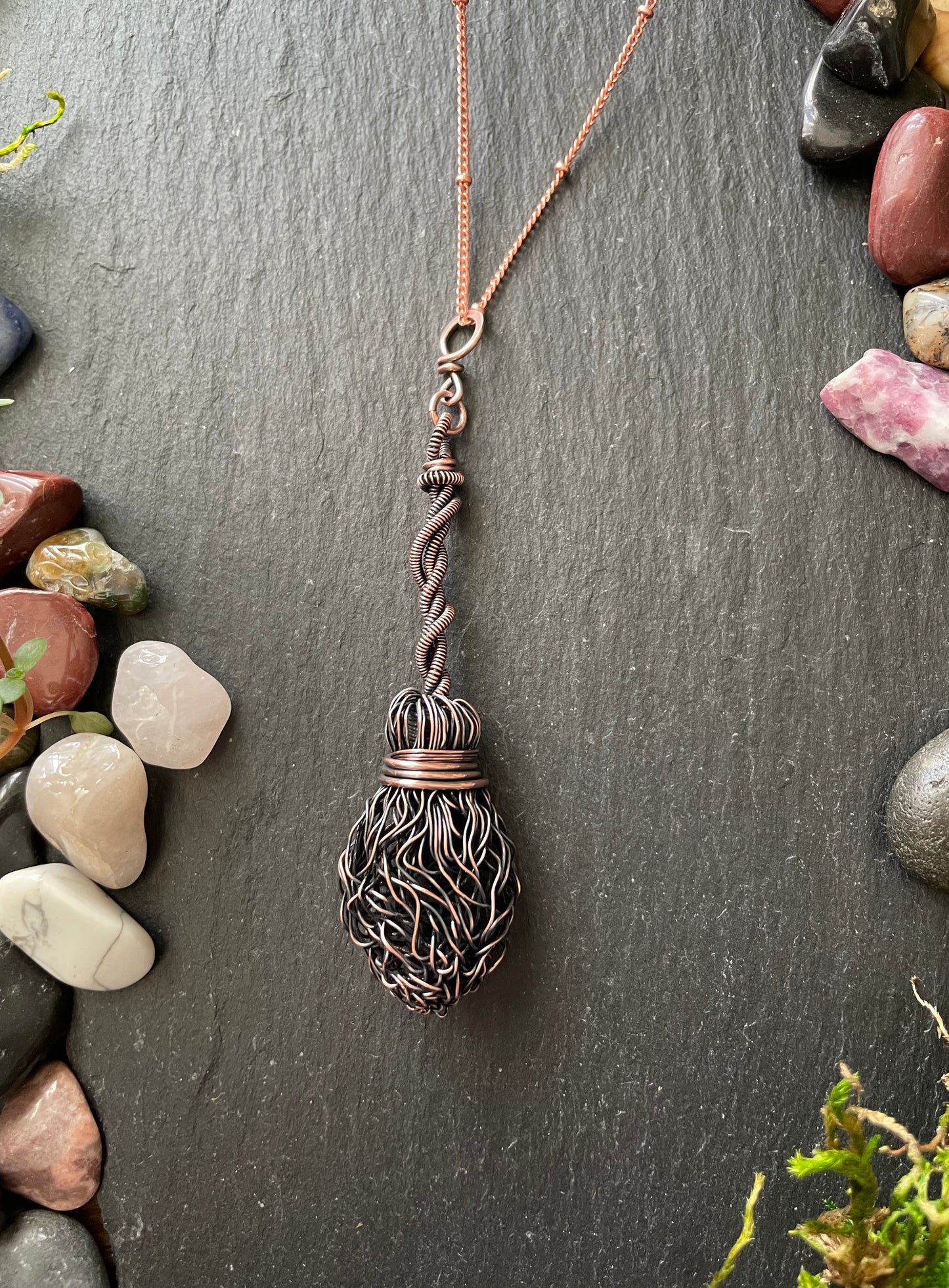 Image of miniature broom pendant with twisted handle