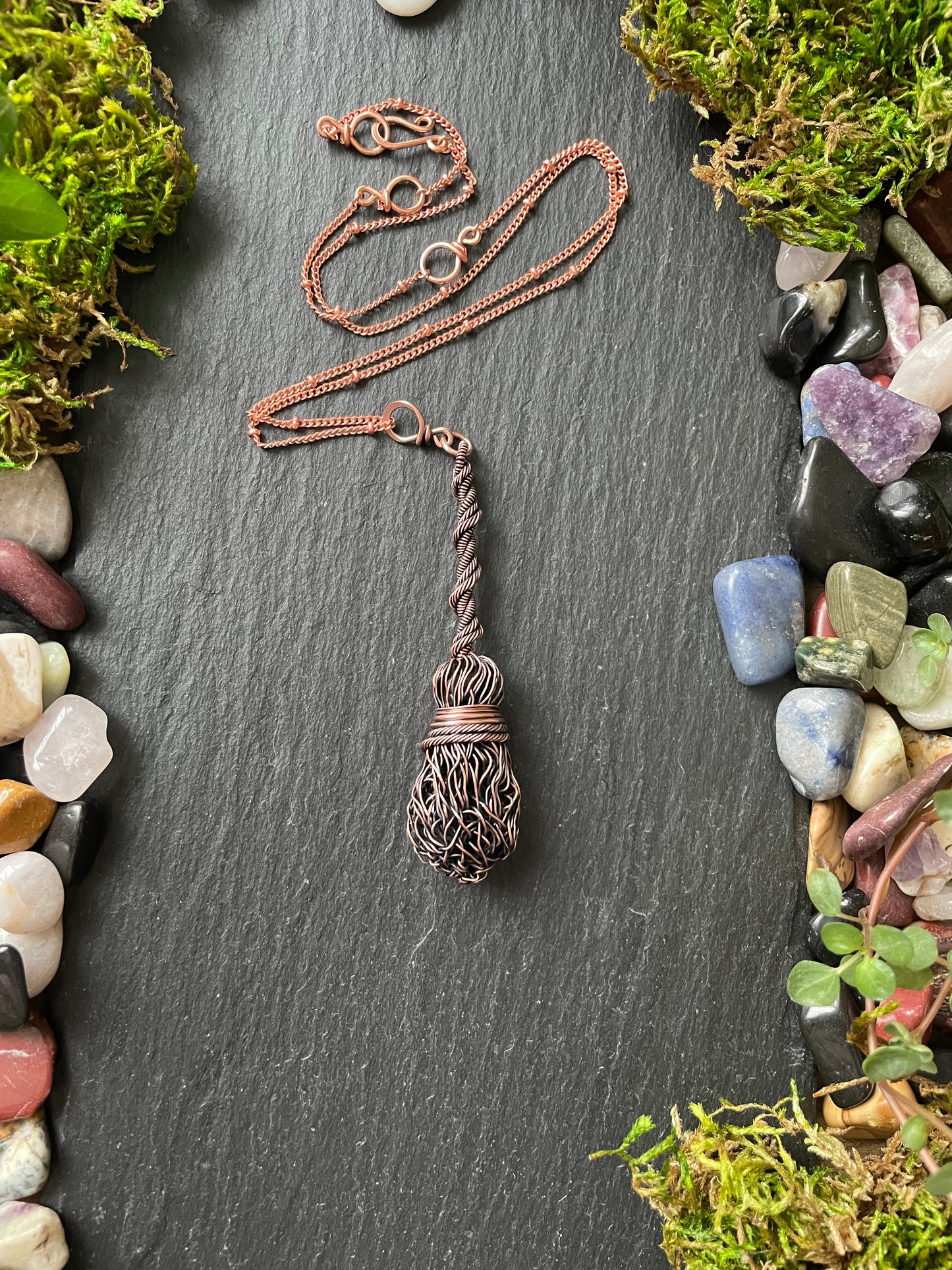 Image of a miniature broom pendant necklace