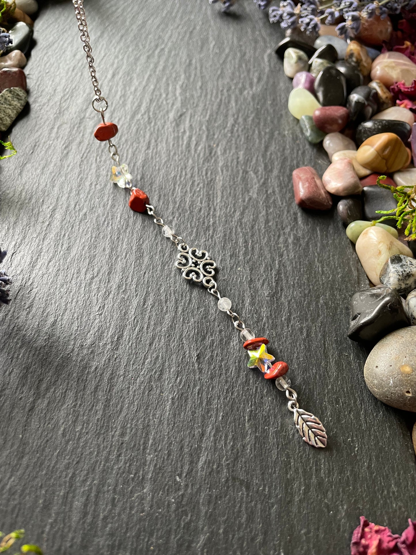 Crystal car charm with red jasper and star beads, and silver leaf charm