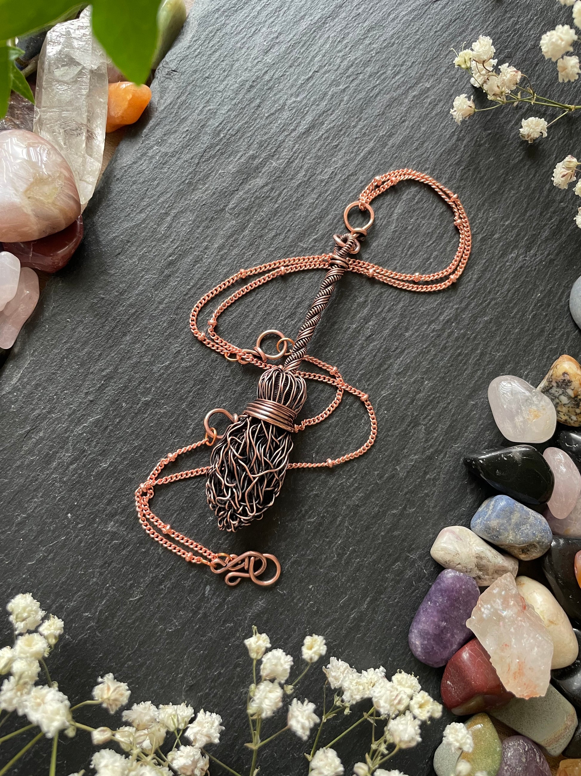 Image of antiqued copper broom pendant