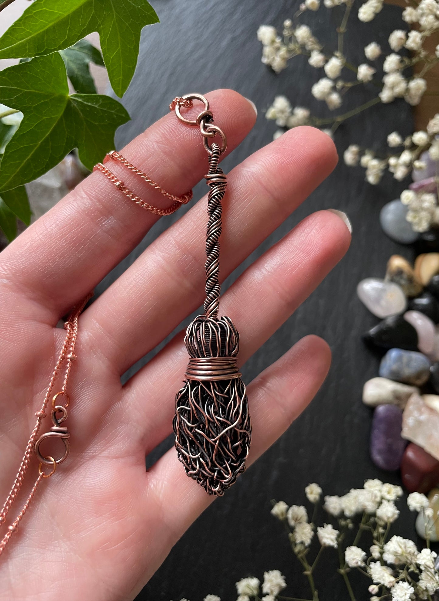 Image of antiqued copper broom pendant