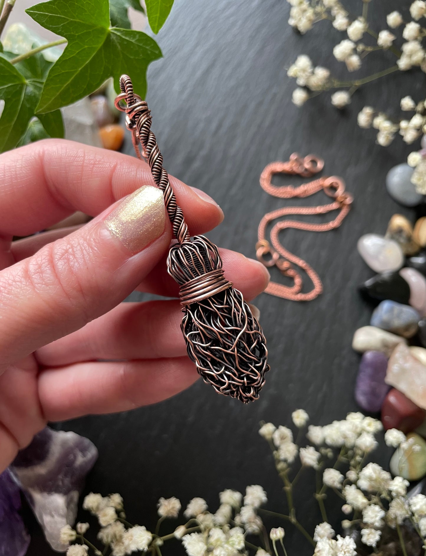 Image of antiqued copper broom pendant