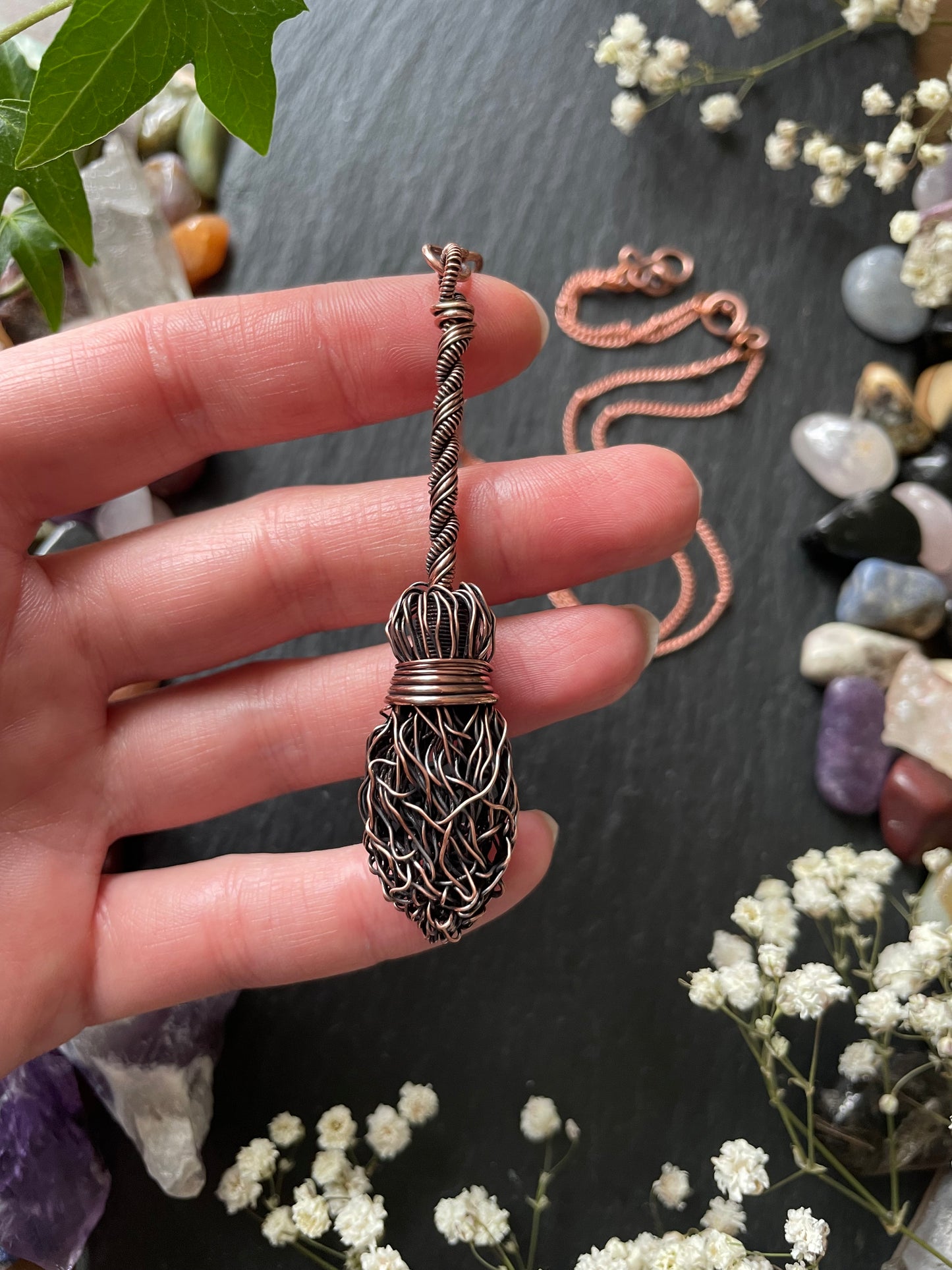 Image of antiqued copper broom pendant