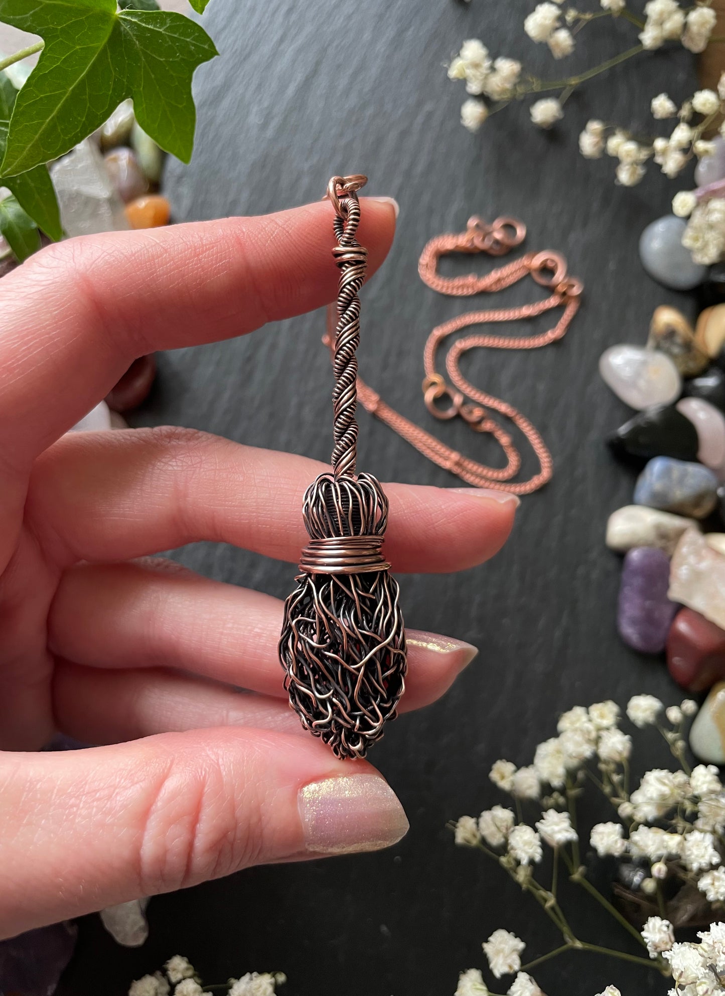 Image of antiqued copper broom pendant