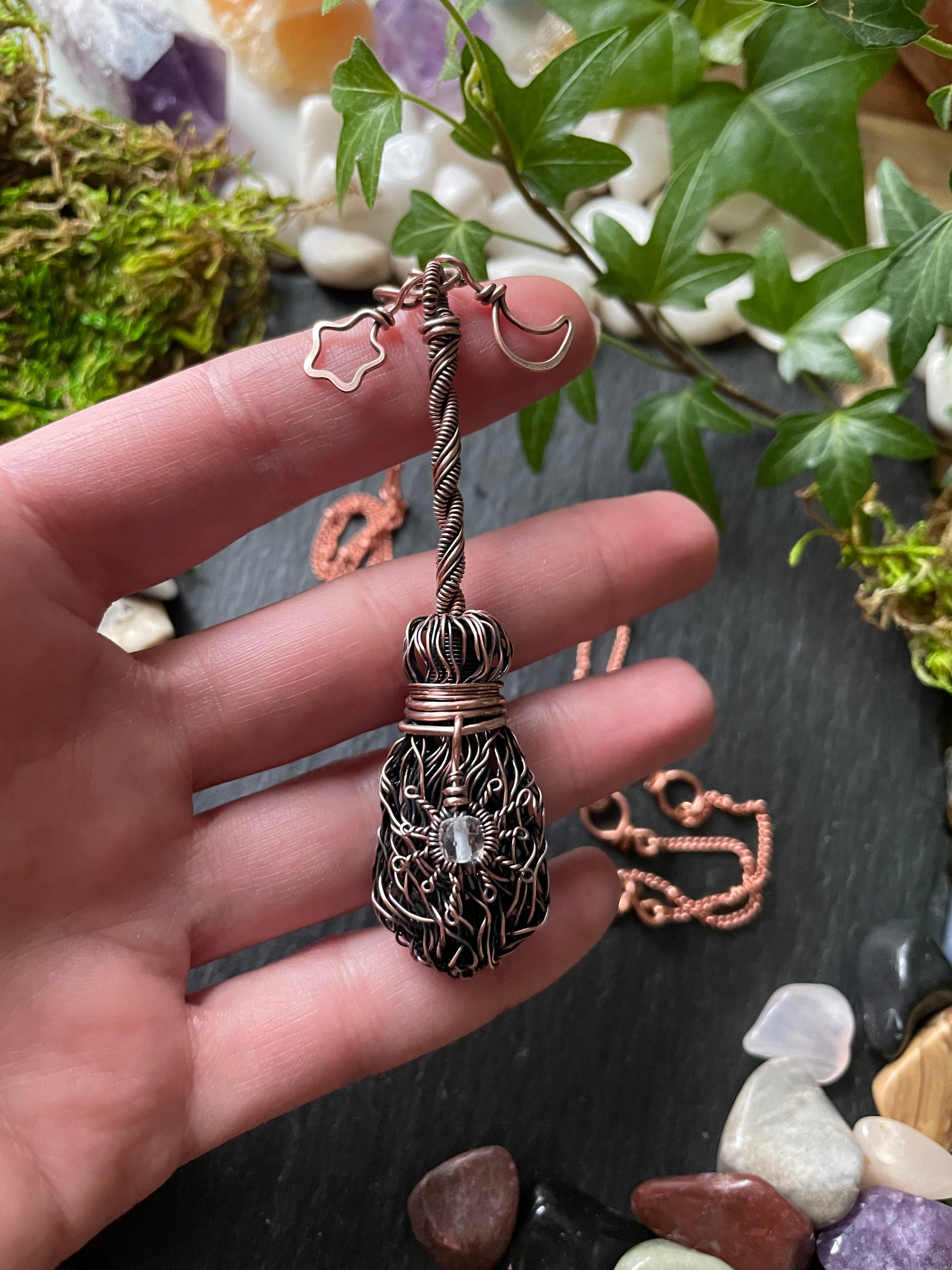 Image of antiqued copper broom pendant