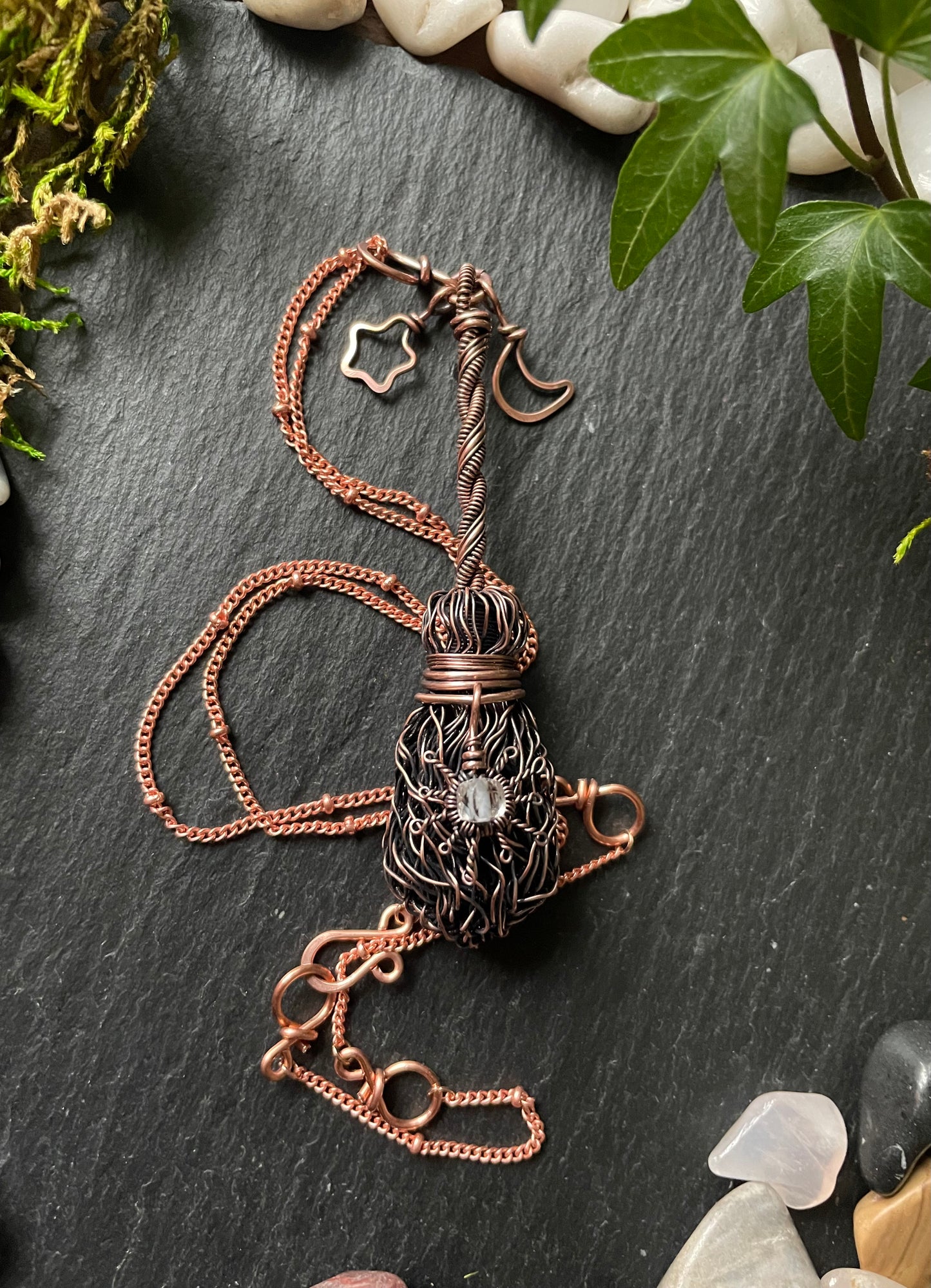 Image of antiqued copper broom pendant