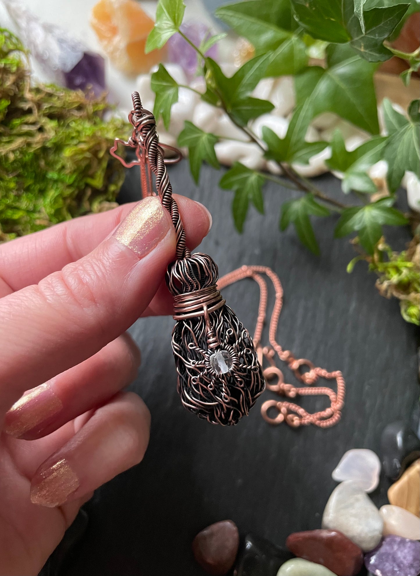 Image of antiqued copper broom pendant 