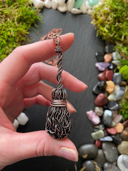 Image of antiqued copper broom pendant with twisted handle
