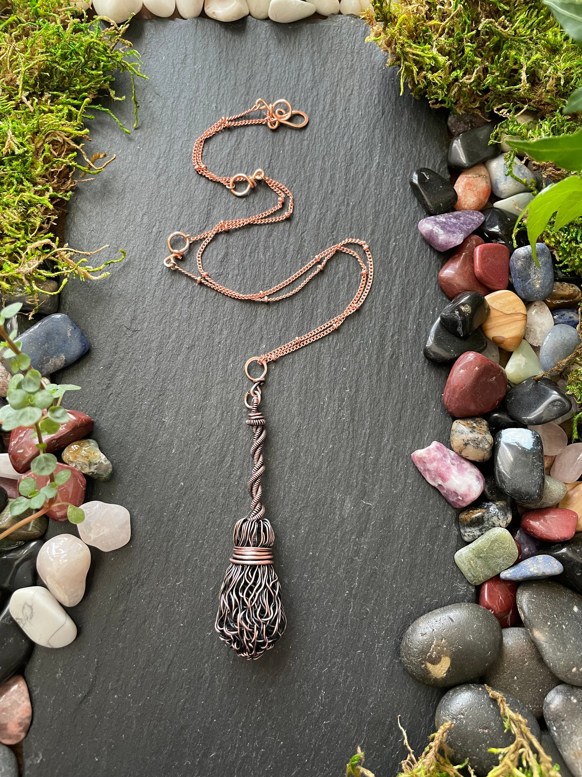 Image of antiqued copper broom pendant with twisted handle