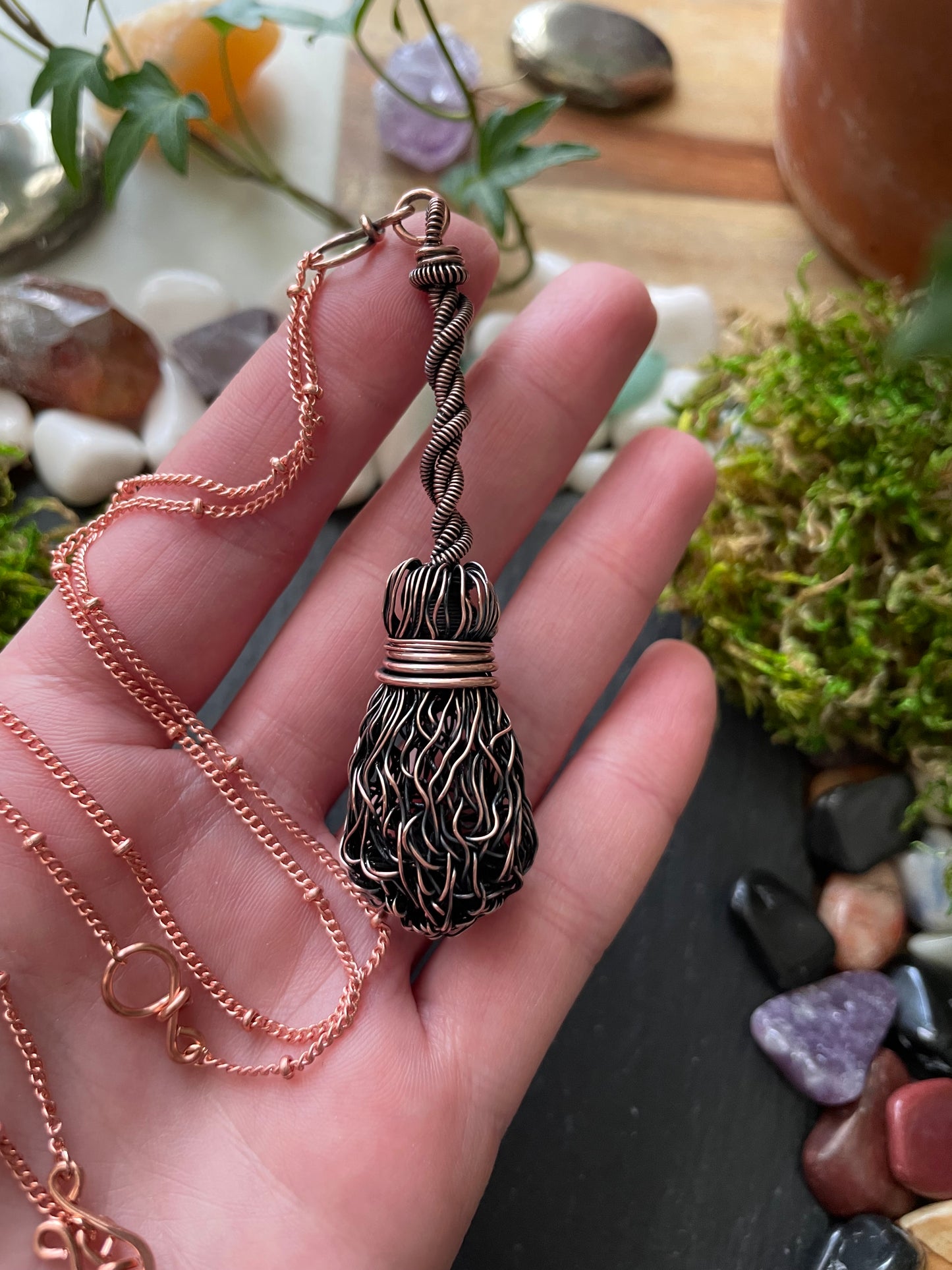 Image of miniature copper wire broom pendant with twisted handle