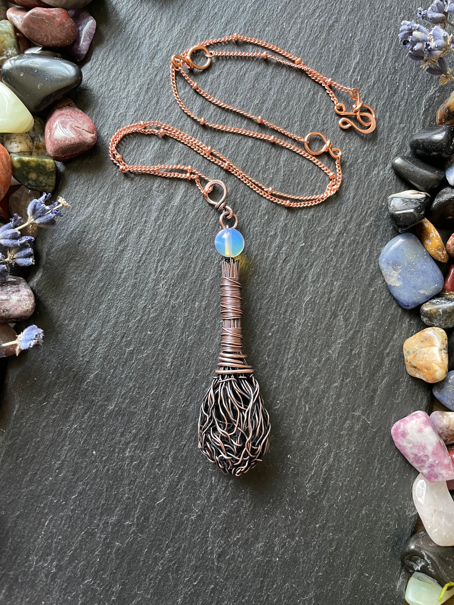 Miniature antiqued copper broom with wire wrapped handle and an opalite bead topper, attached to a matching copper chain