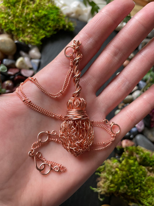 Image of bright copper miniature witch broom pendant with double twisted handle