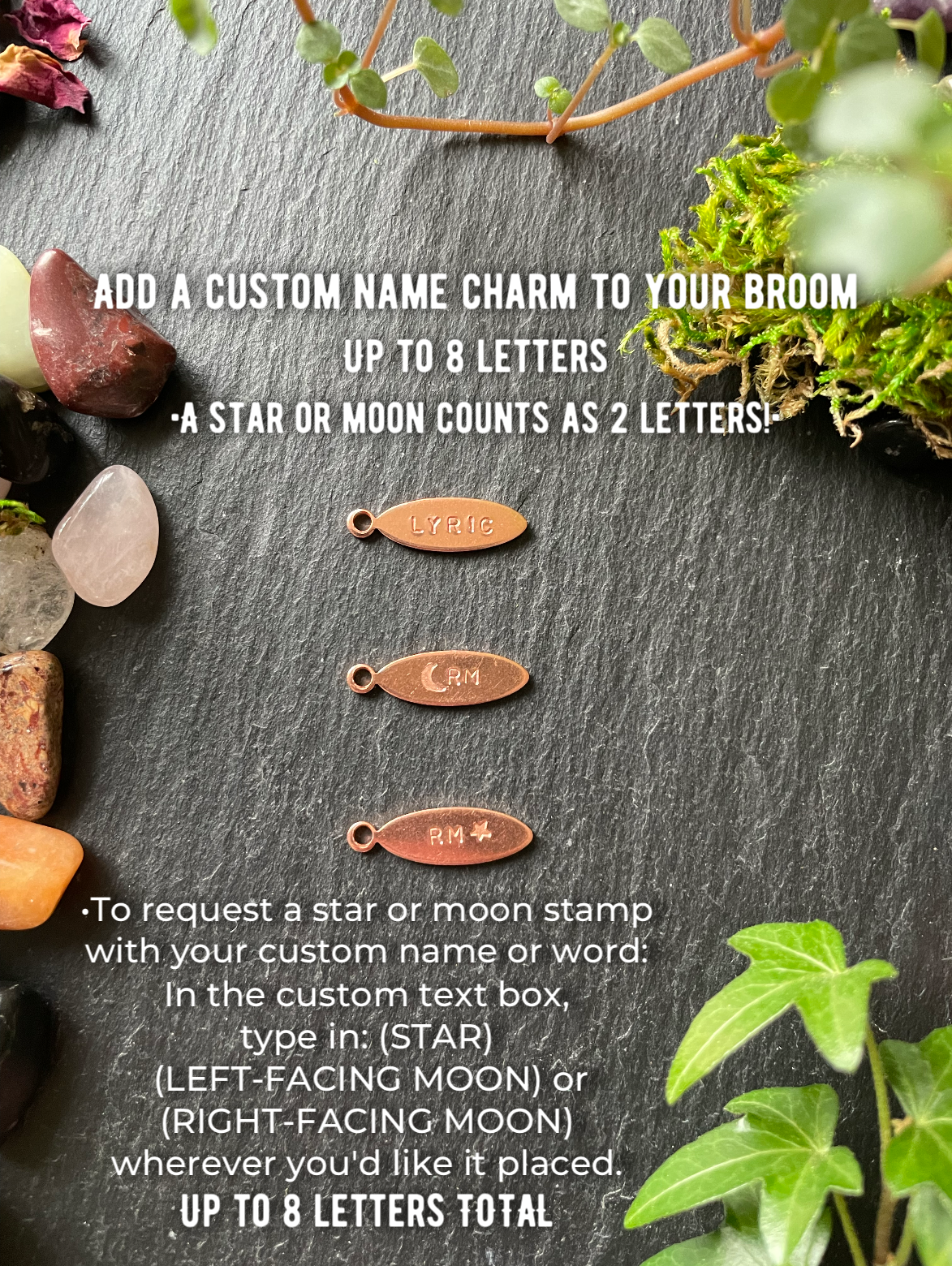 Decorative broom charms with text on a dark surface with plants