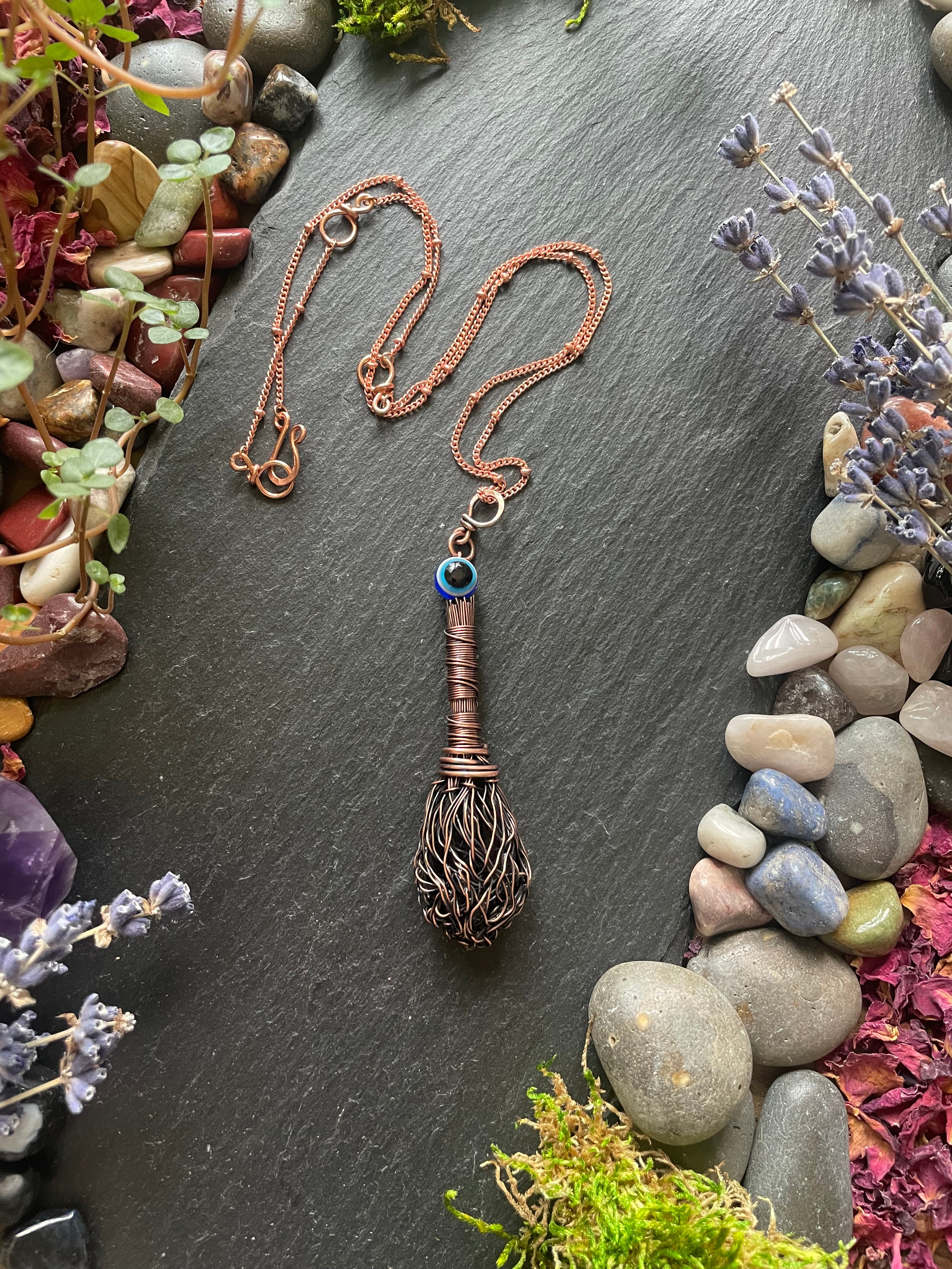 Miniature handmade broom pendant with evil eye bead on a copper chain
