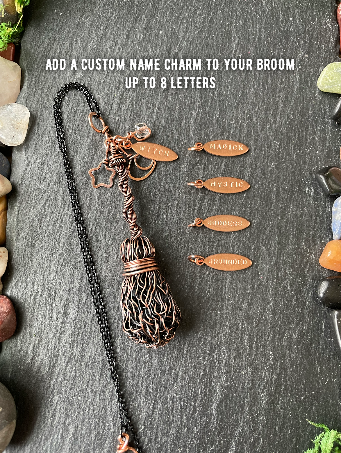 A handmade copper wire broom, displayed on a dark slate background with small engraved copper name charms and white text that reads 'ADD A CUSTOM NAME CHARM TO YOUR BROOM UP TO 8 LETTERS'.