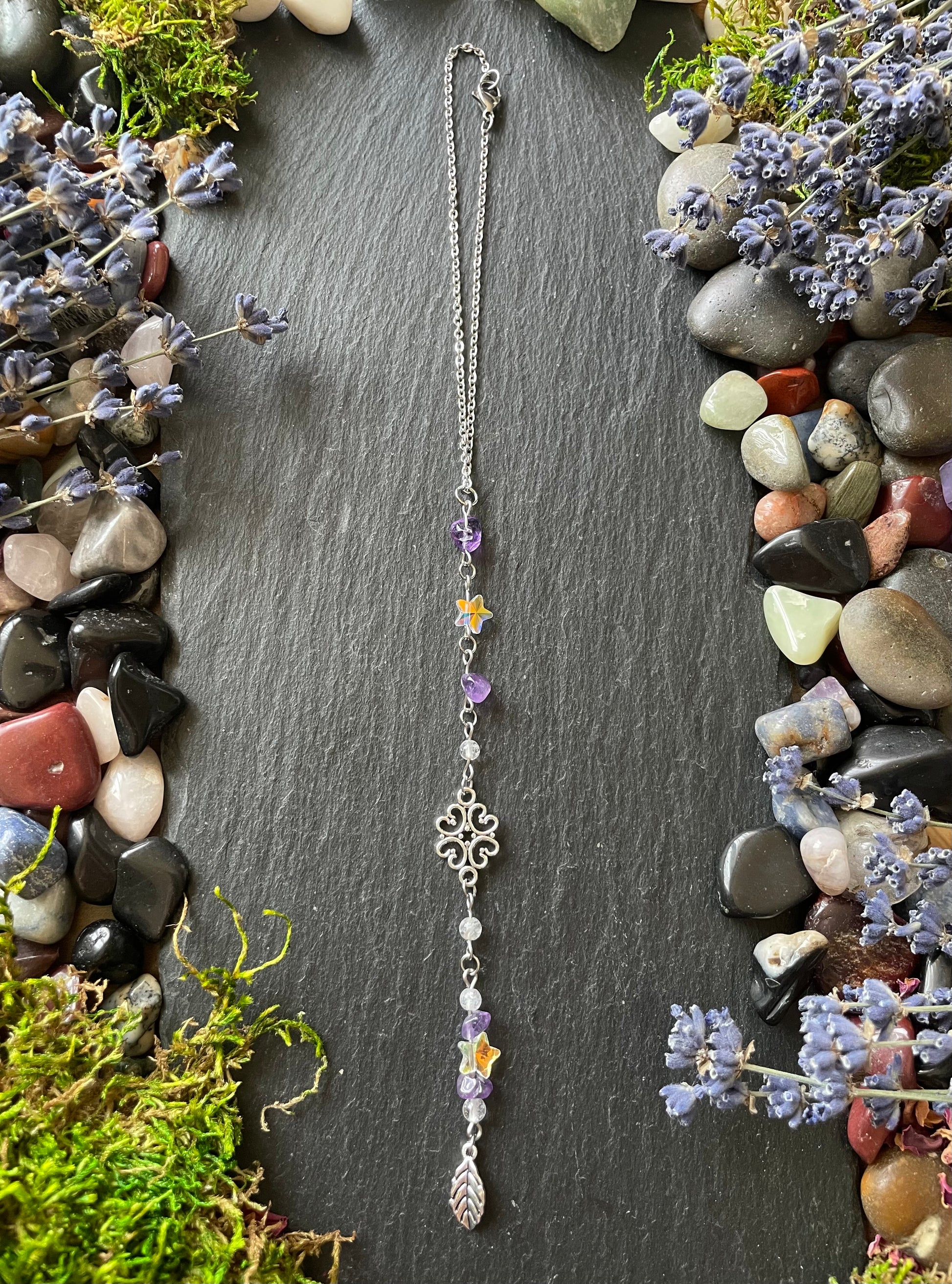Car charm with amethyst beads, star charms, and silver leaf