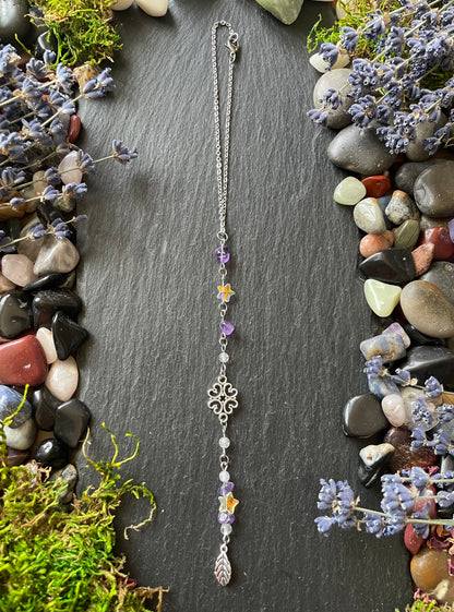 Car charm with amethyst beads, star charms, and silver leaf