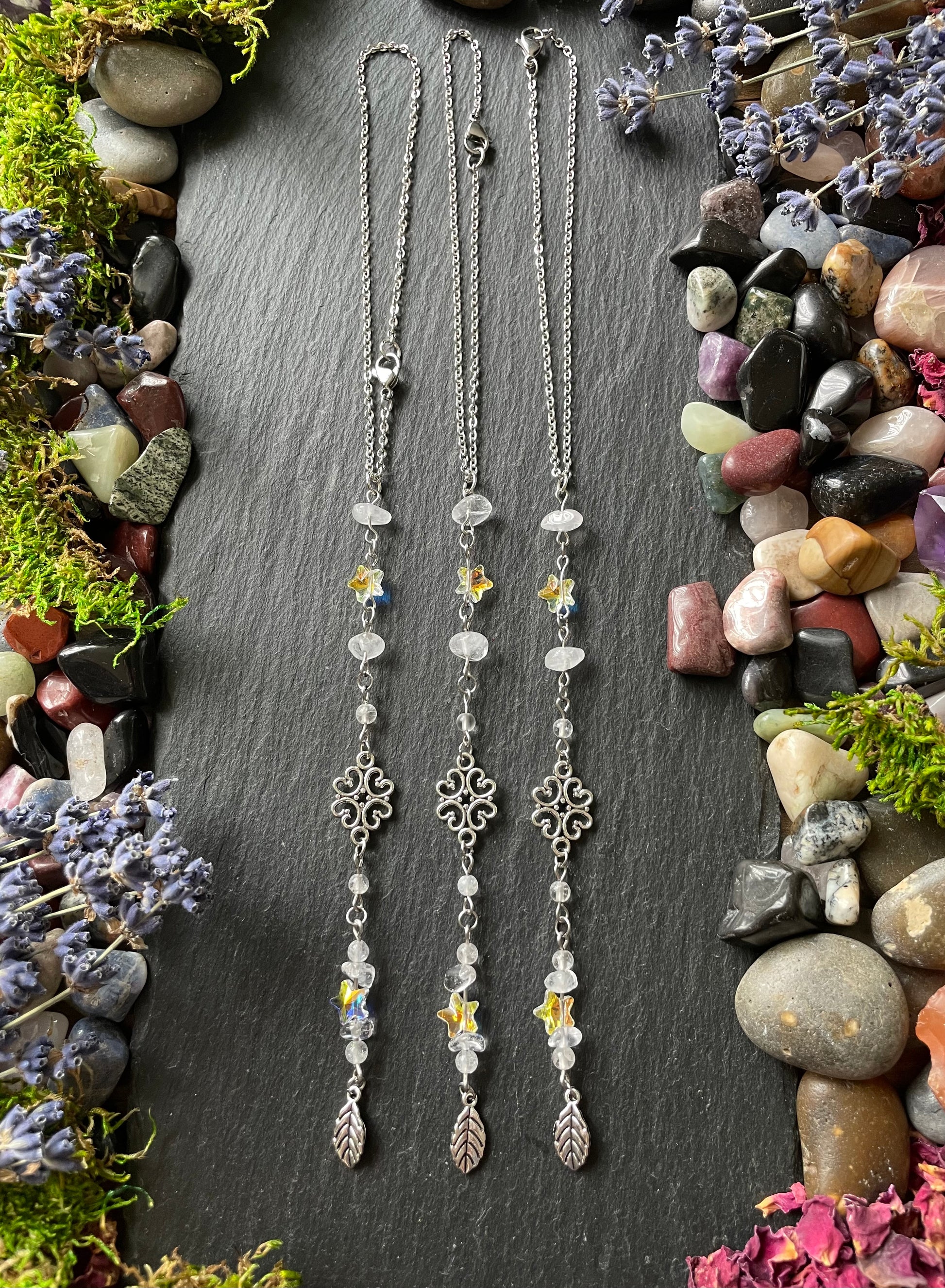 Three crystal car charms with quartz and star beads, and silver leaf charms