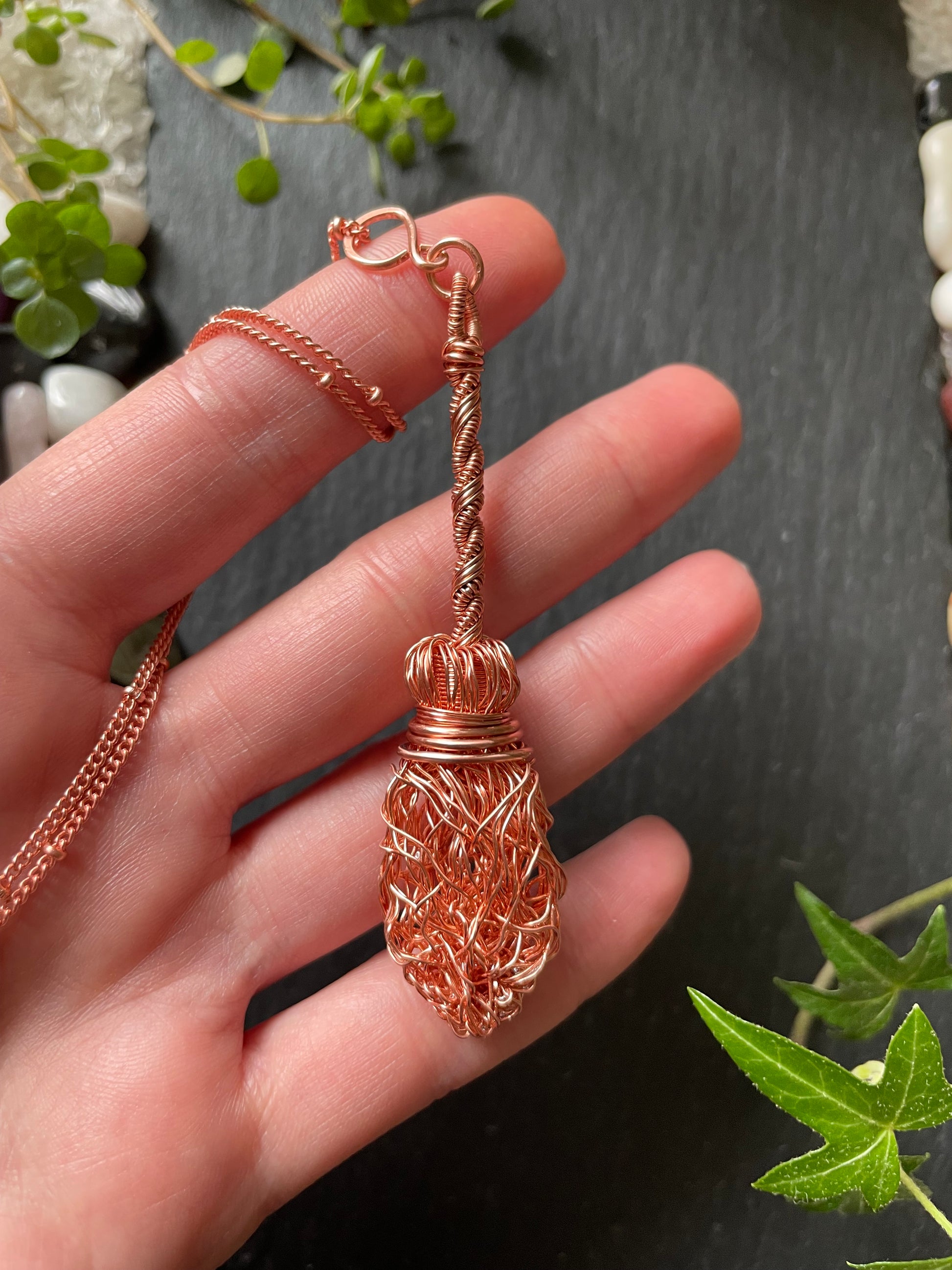 Image of a miniature copper broom pendant made with copper wires