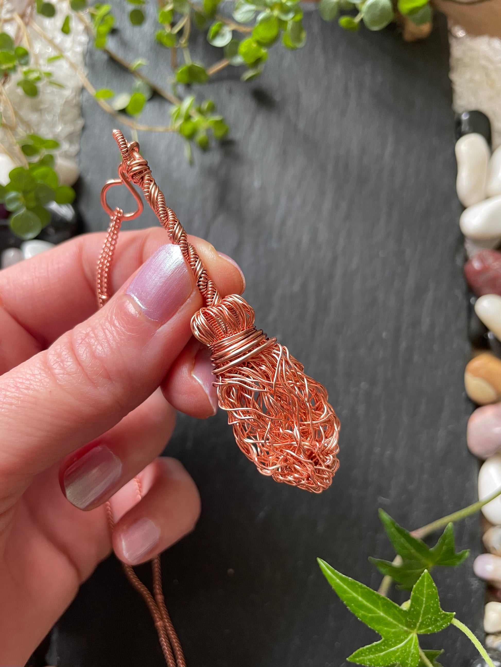 Image of a miniature broom made of copper wires