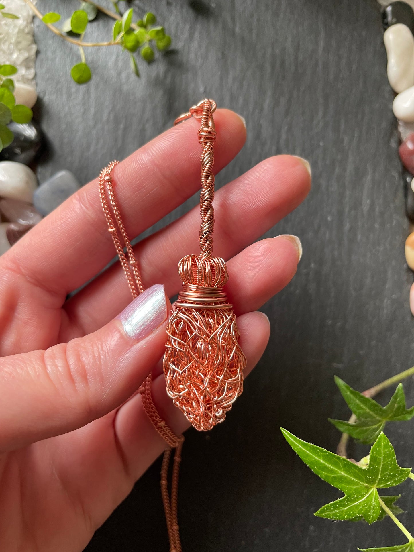 Image of a miniature copper wire broom pendant