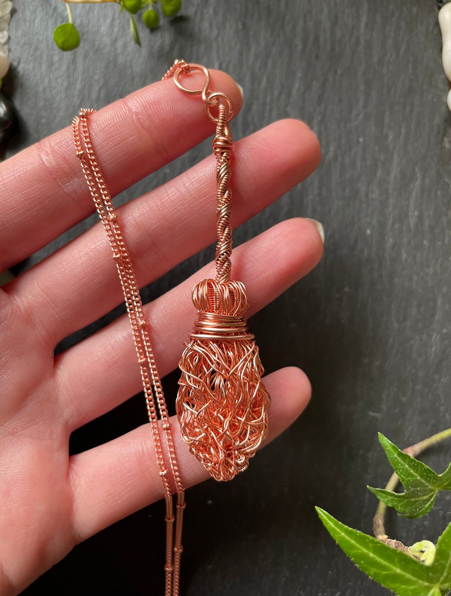 Image of a miniature broom made with copper wires