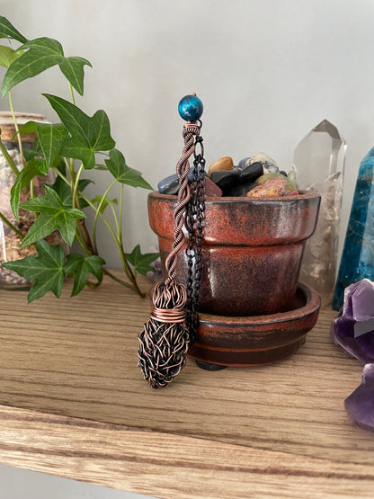 Image of miniature witch broom with blue tiger's eye bead