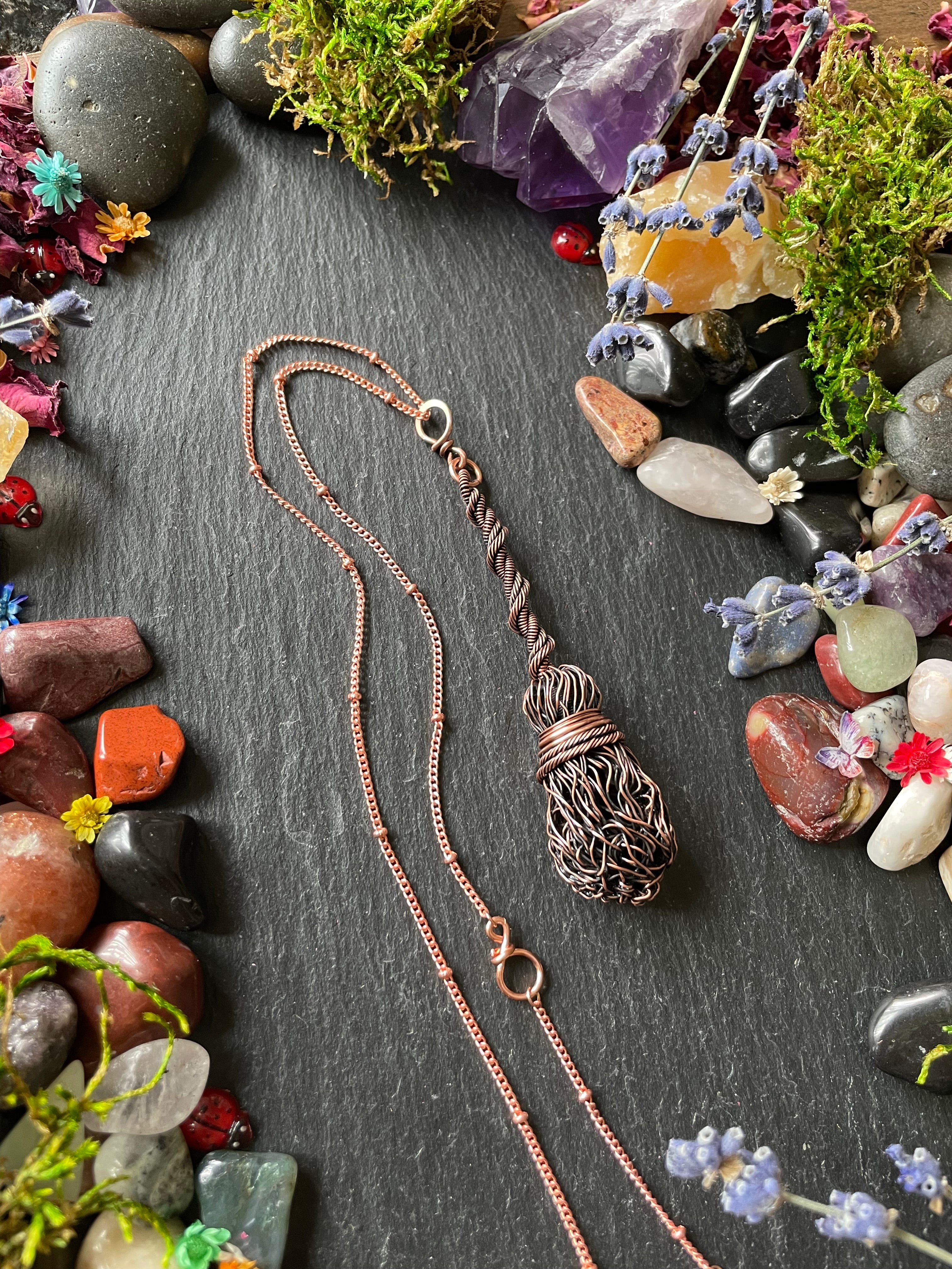 Antiqued copper miniature witch's broom pendant, attached to a copper chain