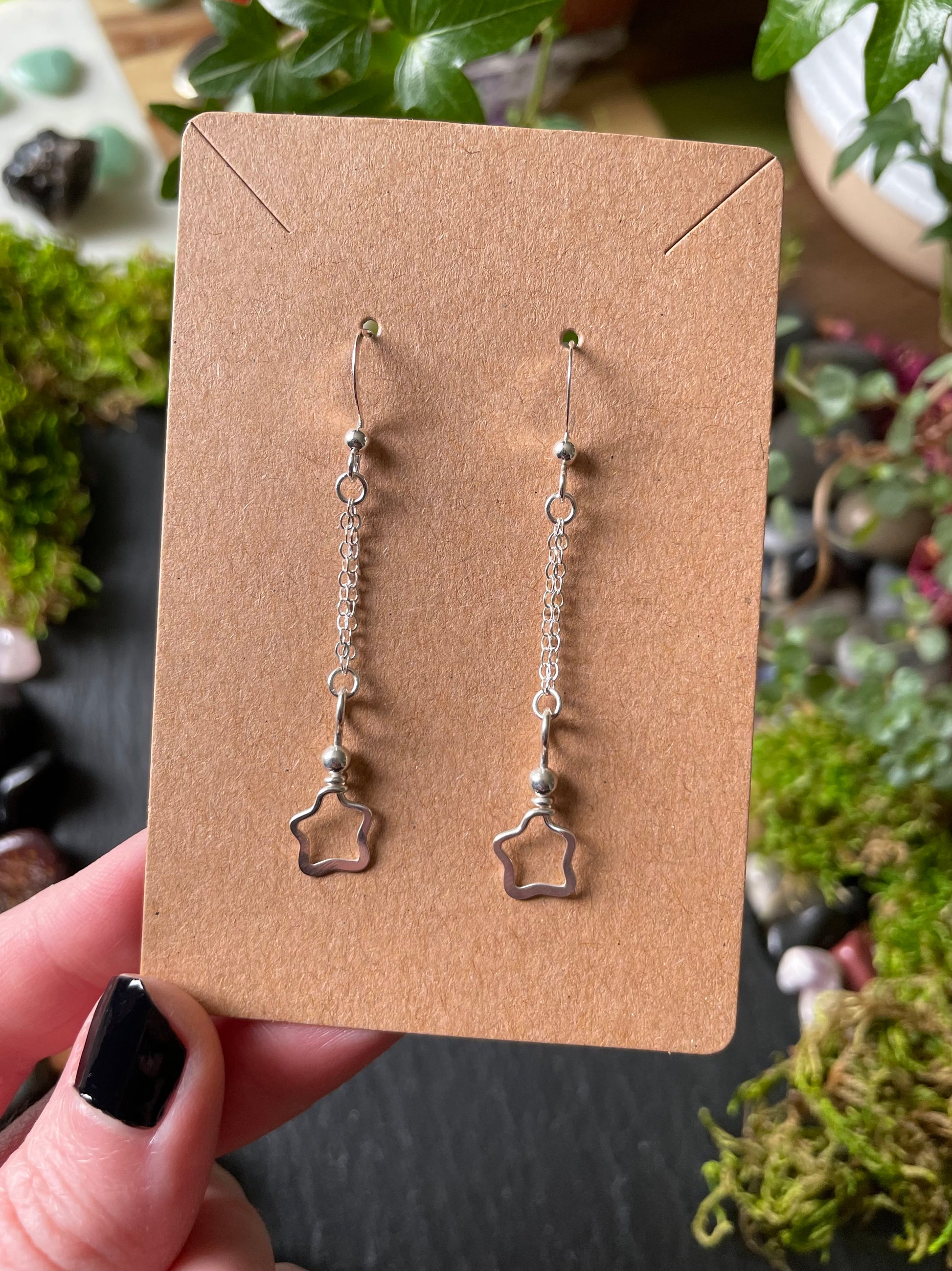 Image of silver star charm earrings