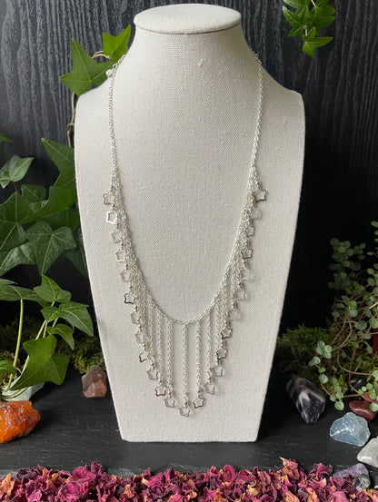 Image of a necklace with silver star charms