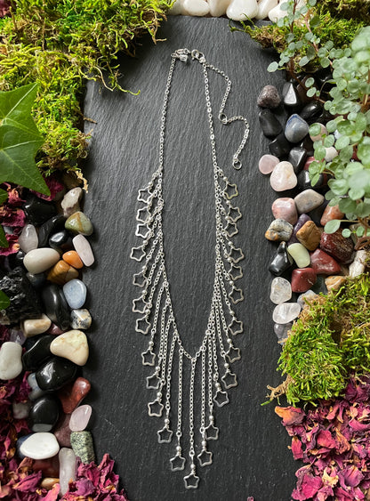 Image of a necklace with silver star charms