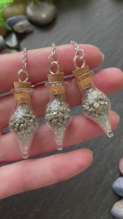 Miniature glass vials with pyrite crystal and sparkles
