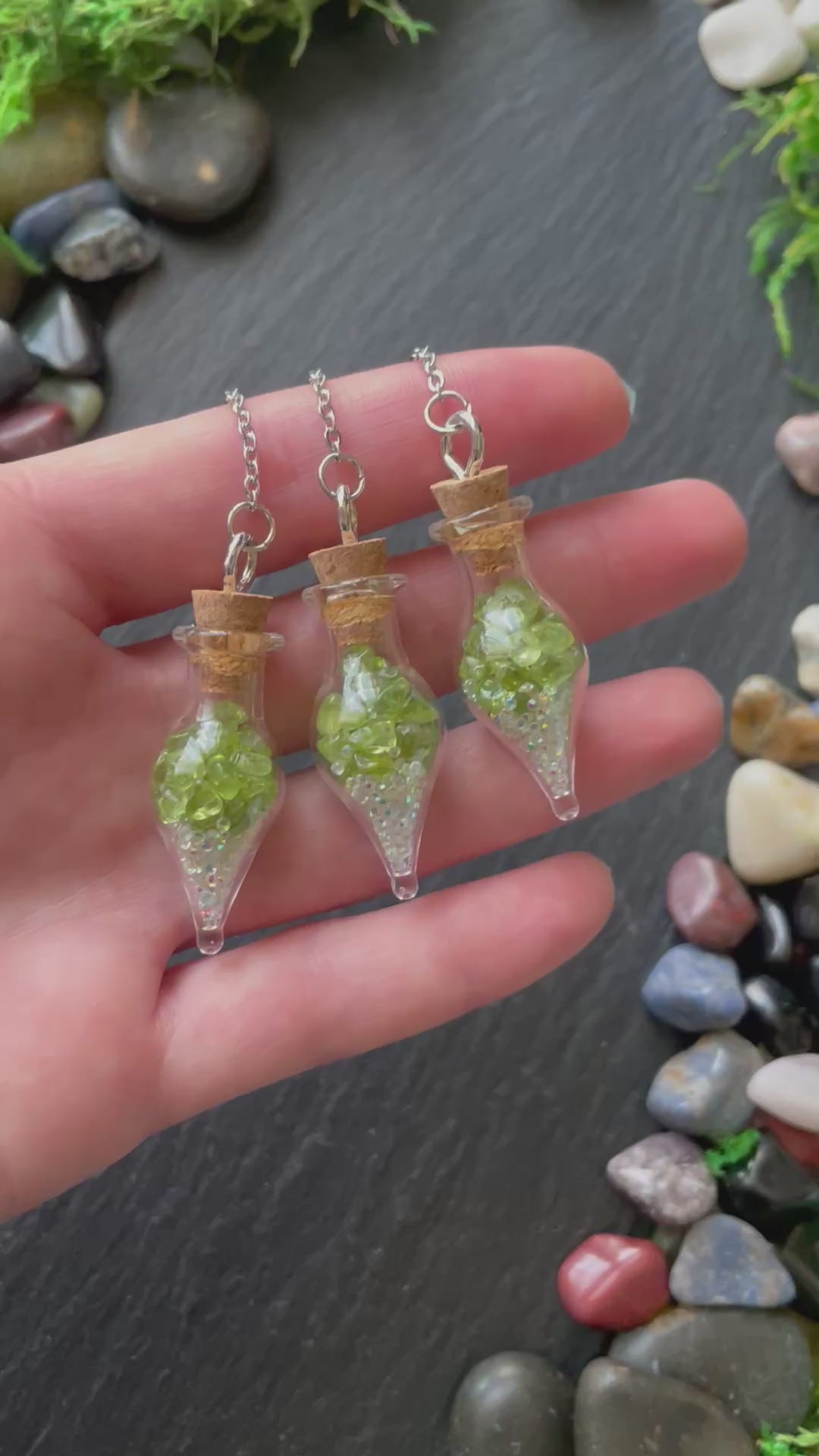 Mini glass vial plant charms with green peridot crystals and sparkles