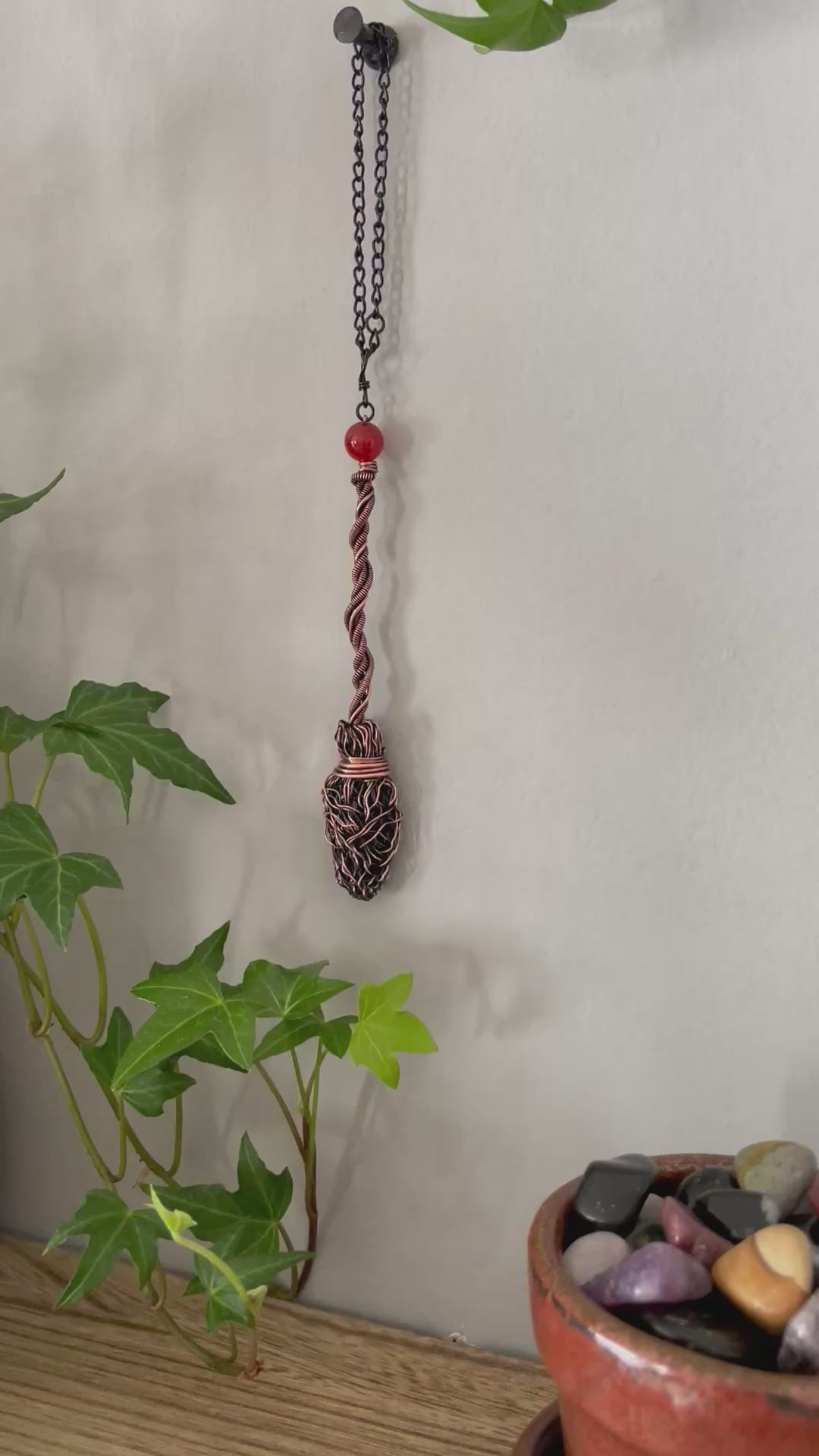 Video of miniature copper broom with carnelian bead