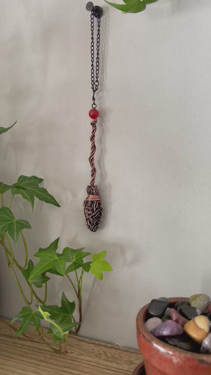 Video of miniature copper broom with carnelian bead