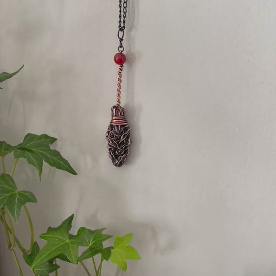 Video of miniature copper broom with carnelian bead