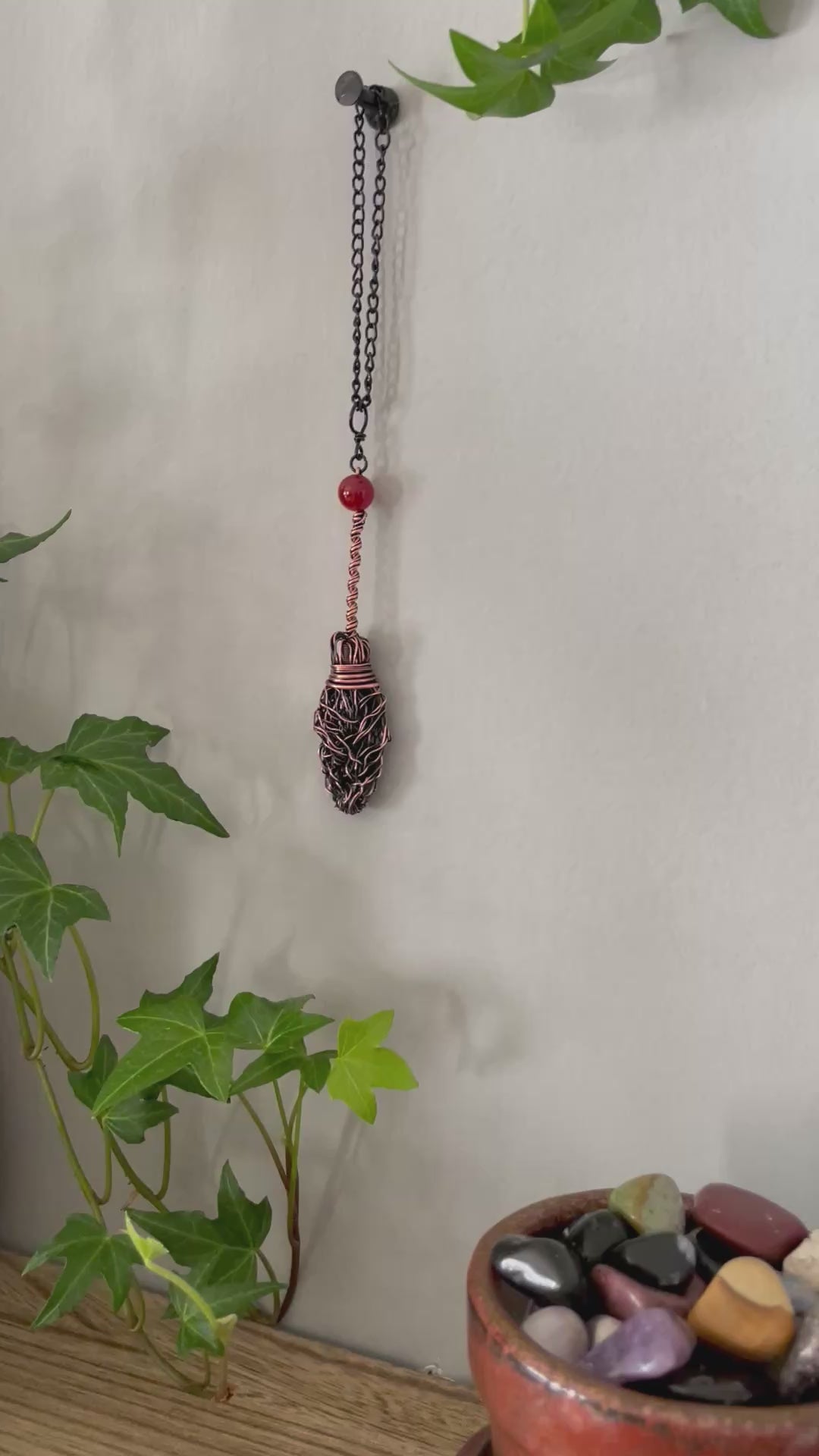 Video of miniature copper broom with carnelian bead