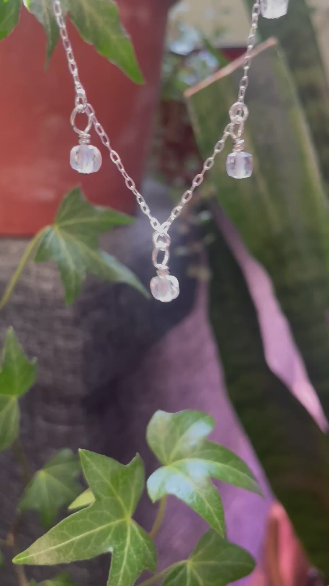 Video of silver necklace with quartz bead charms 