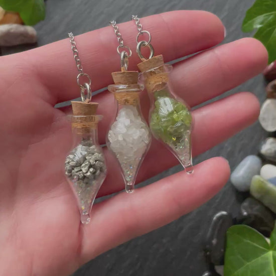 Mini glass vial plant charms with various colorful crystals and sparkles